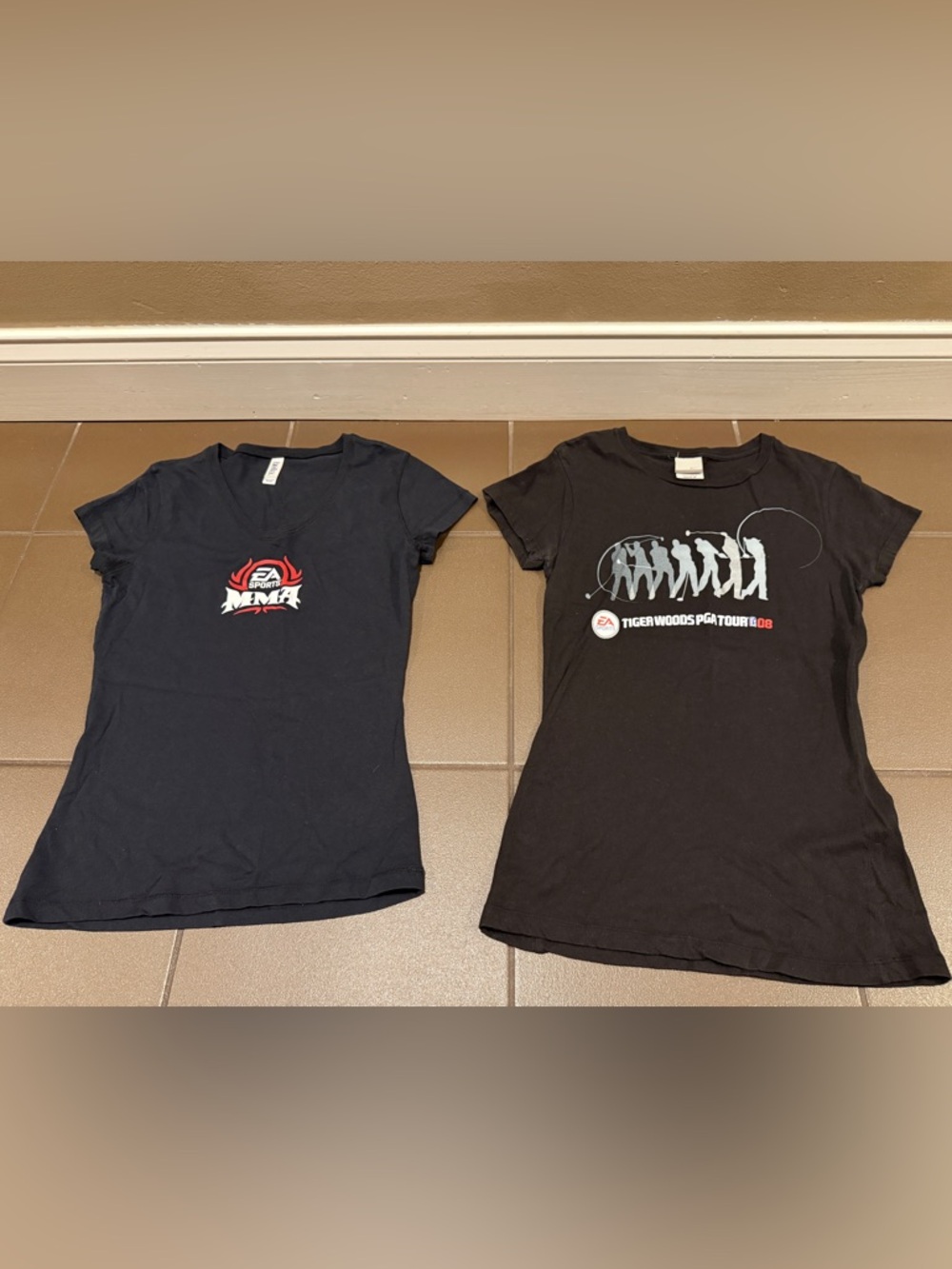 Two black EA Sports tshirts